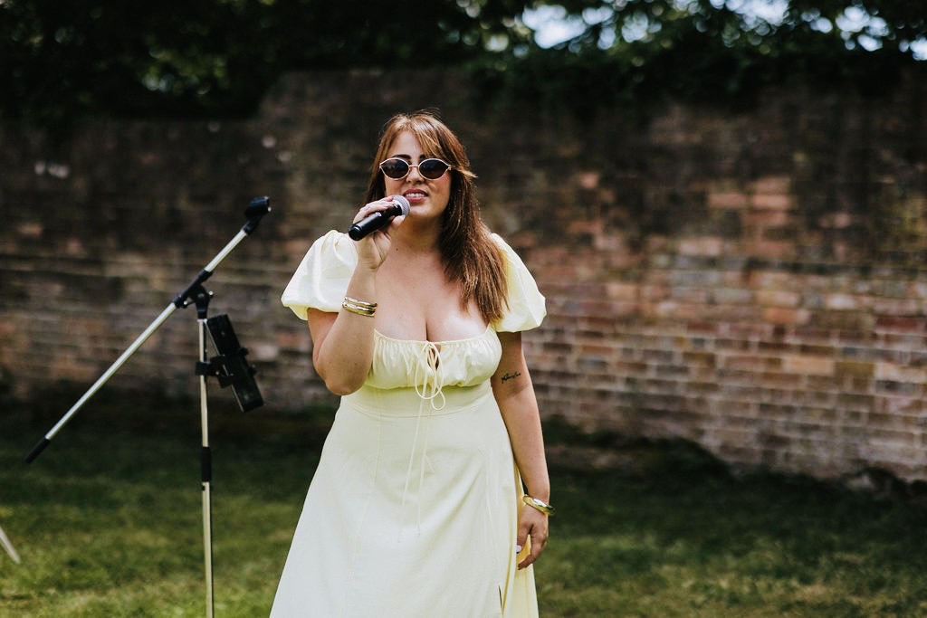 Emma Bennett performing at an outdoor celebration